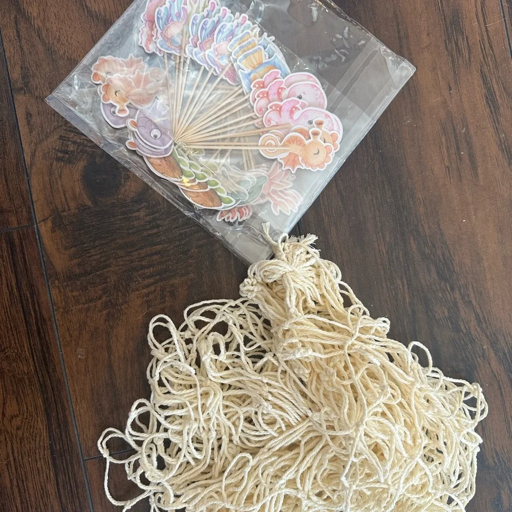 Under the sea toppers, fish net, and goodie bags
